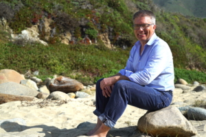 Arnold Leitner on Garrapata Beach in Big Sur during the filming of YouSolar’s 2020 StartEngine campaign video.