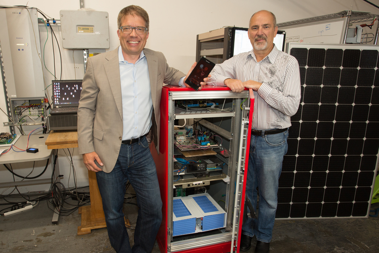 It Started with a Vision. Arnold Leitner, Founder and CEO, with his friend and business partner Gene Krzywinski, CEO of eIQ Energy, with the very first prototype of the PowerBloc®.