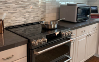 An induction stove in an all-electric home. Large induction stoves like the one shown can have a rating of 17.4 kilowatts!