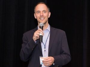 Rupert speaking at the annual conference of his company IPfolio. IPfolio was among the 1,000 fastest-growing private companies in the U.S. according to Inc. Magazine.