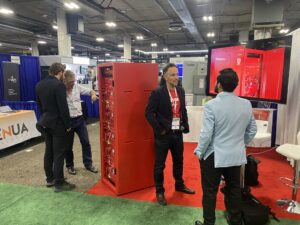 The YouSolar booth at RE+ 2023 with Arnold Leitner (CEO), left, and Rupert Mayer (CFO) right, engaging with prospects.