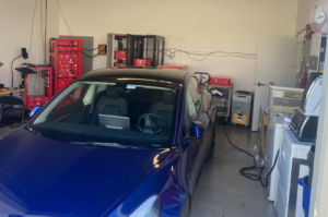 The YouSolar “Wash and Charge”. We test the PowerBloc with a wall full of appliances, but when we need “that extra push,” we back the EV into the lab and put it on the charger.